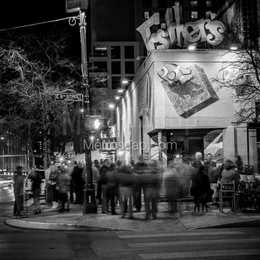 Matte Black MDF Framed Black and White Austin Photograph: Crowds Mingle Outside of Esthers on Sixth in a Square Matte Black MDF Frame