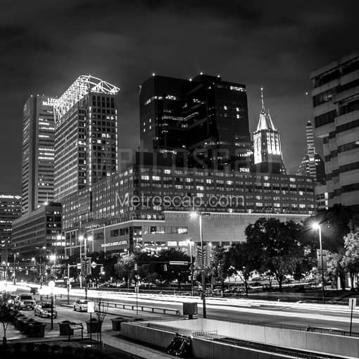 Matte Black MDF Framed Black and White Baltimore Photograph: Traffic in the Foreground of the Baltimore Skyline Along Pratt Street in a Square Matte Black MDF Frame