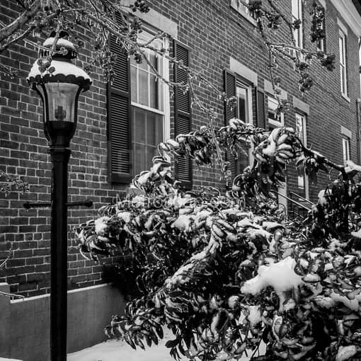 Matte Black MDF Framed Black and White Columbus Photograph: A Snowy German Village Home in a Square Matte Black MDF Frame