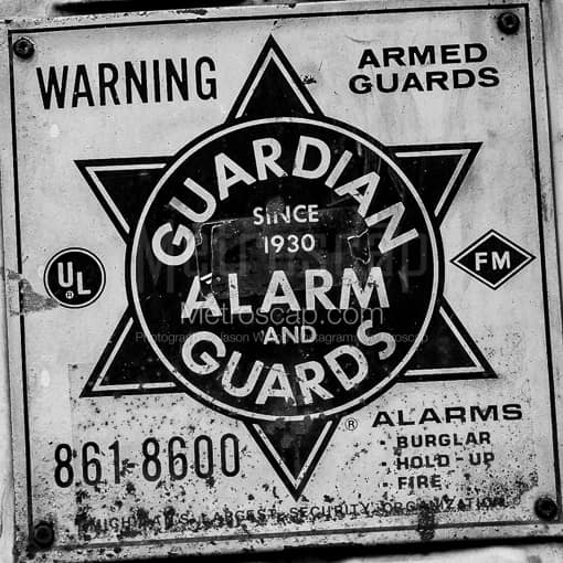 Matte Black MDF Framed Black and White Detroit Photograph: Guardian Alarm and Guards Sign in a Square Matte Black MDF Frame
