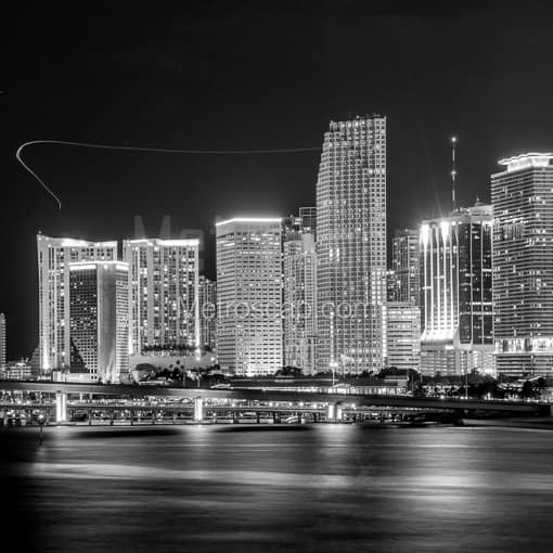Matte Black MDF Framed Black and White Miami Photograph: The Downtown Miami Skyline at Night with Helicopters in a Square Matte Black MDF Frame