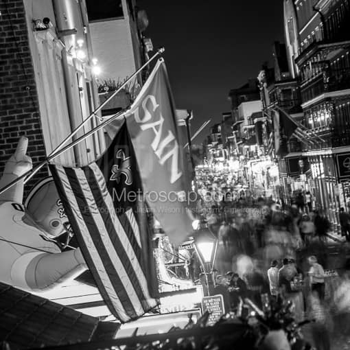 Matte Black MDF Framed Black and White New Orleans Photograph: Saints Flag Hang above Bourbon Street in a Square Matte Black MDF Frame