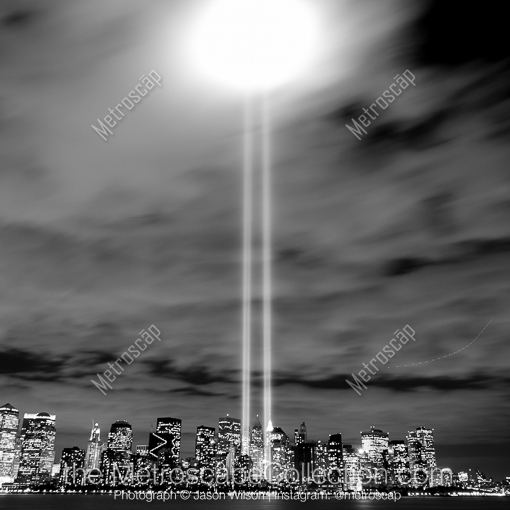 Matte Black MDF Framed Black and White New York City Photograph: The Beams of Light from Lower Manhattan Bounce off of the Low Clouds in a Square Matte Black MDF Frame