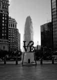 Love Sculpture At Dusk Black and White Vertical Love Sculpture At Dusk black and white