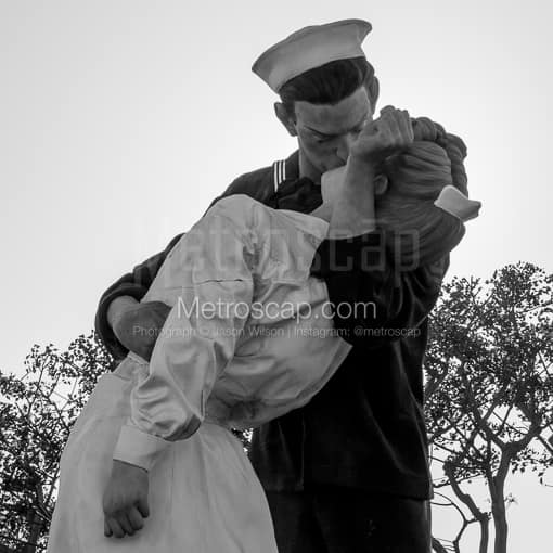 Matte Black MDF Framed Black and White San Diego Photograph: The Kissing Sailor Sculpture Near the USS Midway in a Square Matte Black MDF Frame